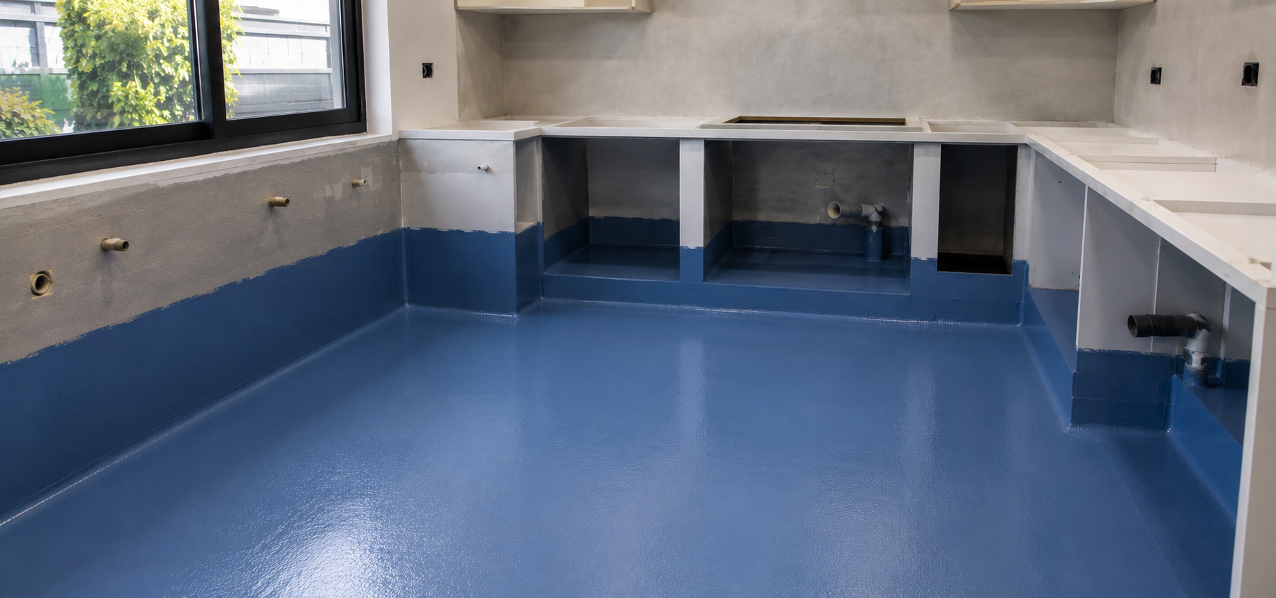 Kitchen and laundry waterproofing specialist applying membrane in a Sydney home